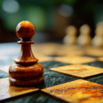 A solitary wooden pawn stands on a chess board with blurred pieces suggesting an ongoing game and strategic thinking